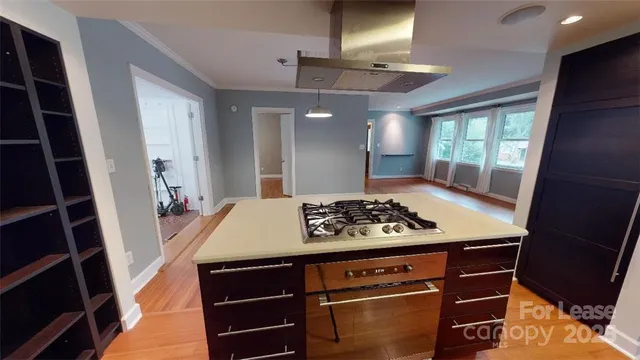 a kitchen with a stove and a refrigerator