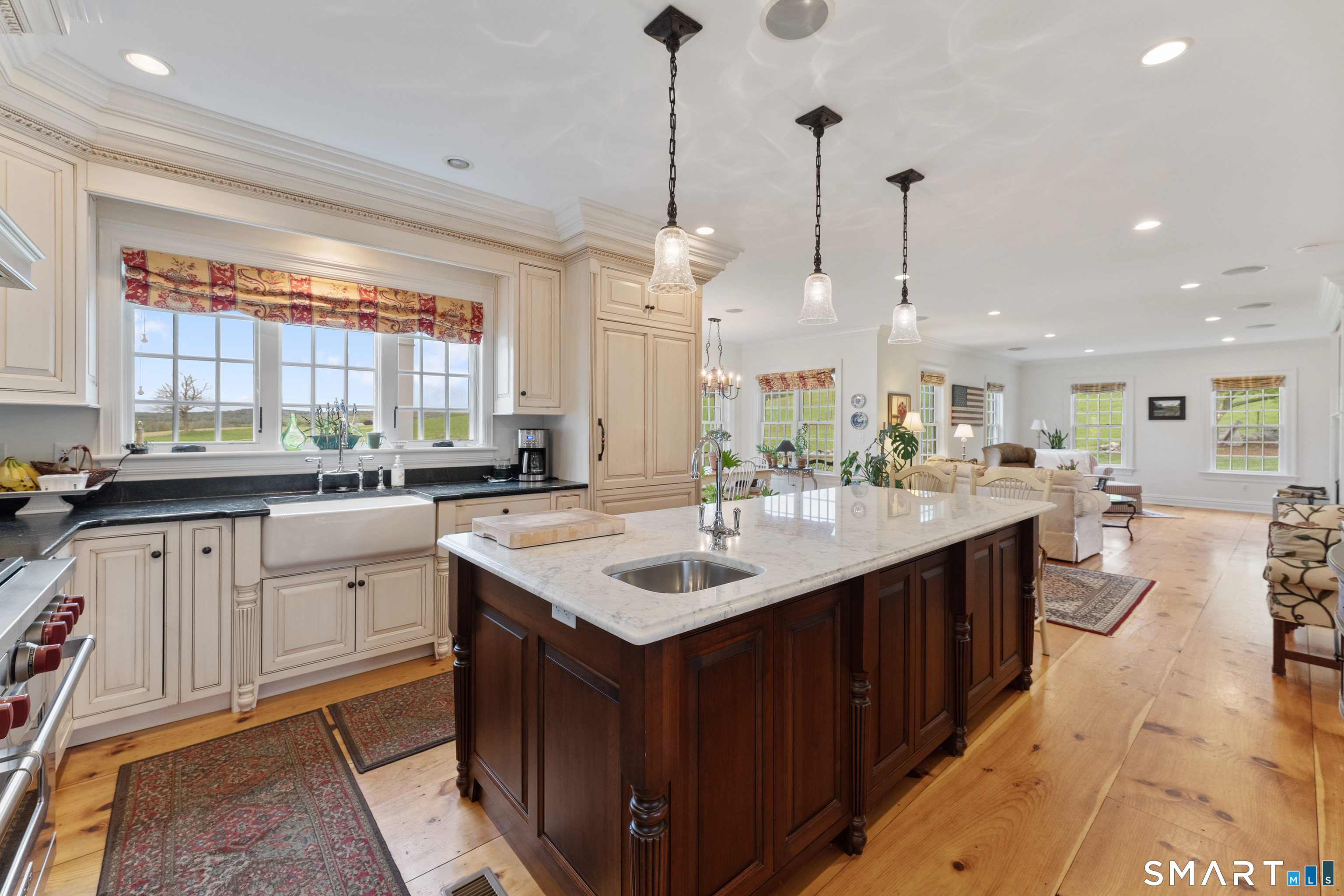 155 Paine Road Woodstock, CT 06281 - Photo 6 of 40 a kitchen with kitchen island granite countertop a sink counter top space and a center island