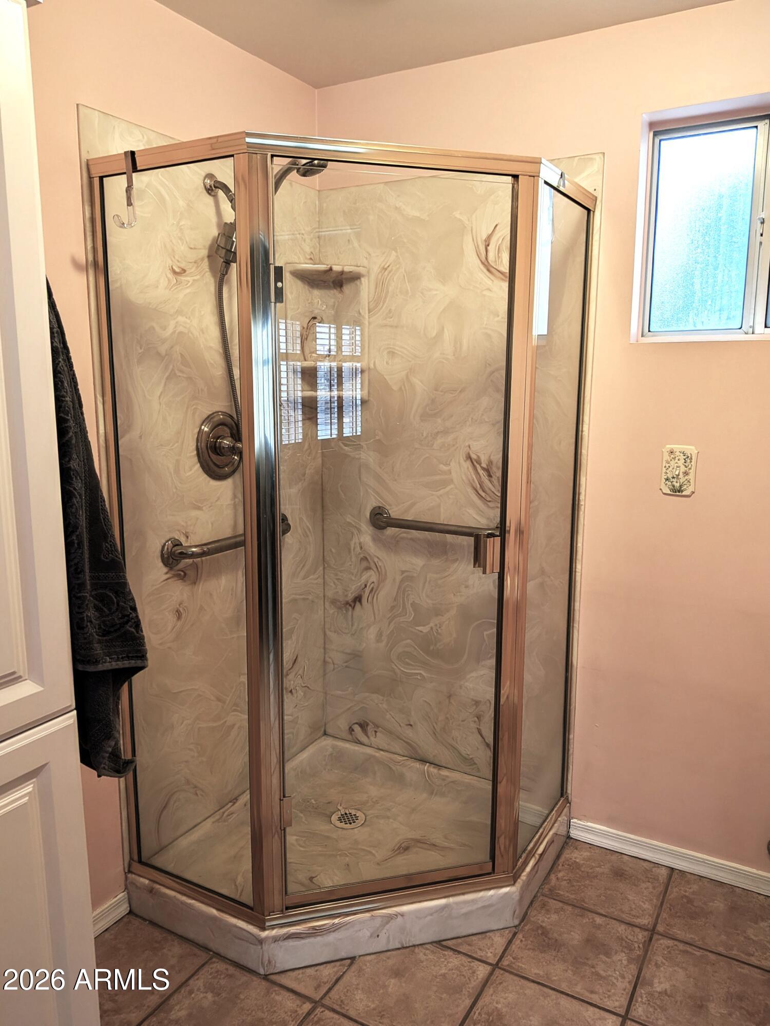 6700 East Thomas Road, Unit 25 Scottsdale, AZ 85251 - Photo 11 of 29 a bathroom with a glass shower door