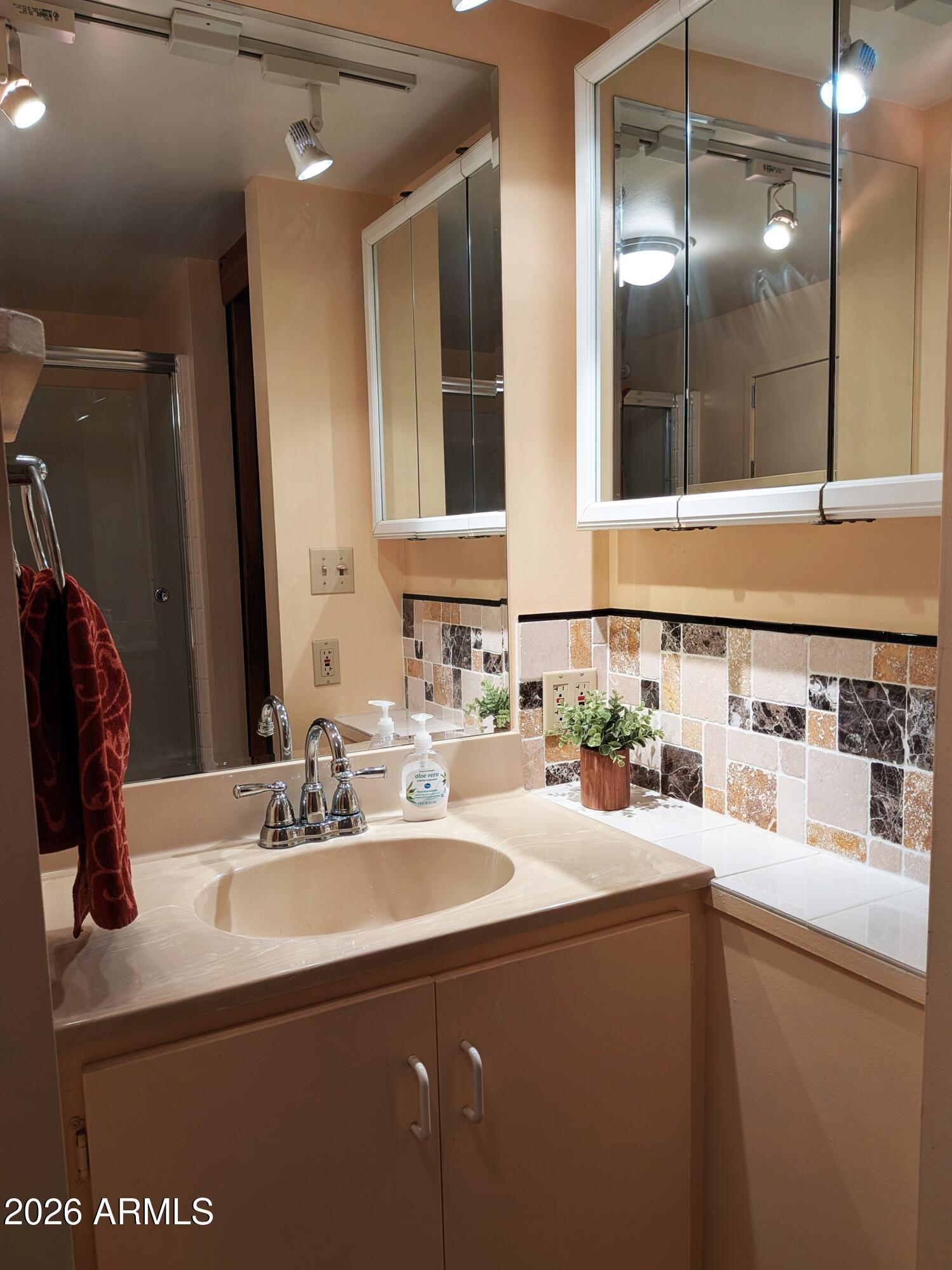 6700 East Thomas Road, Unit 25 Scottsdale, AZ 85251 - Photo 13 of 29 a bathroom with a sink and a mirror