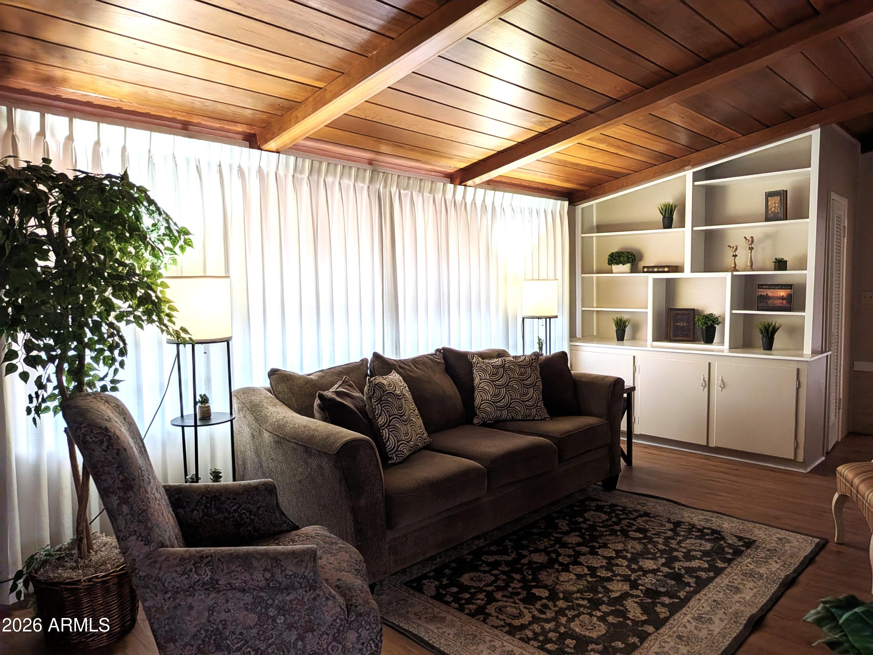 6700 East Thomas Road, Unit 25 Scottsdale, AZ 85251 - Photo 2 of 29 a living room with furniture and a rug