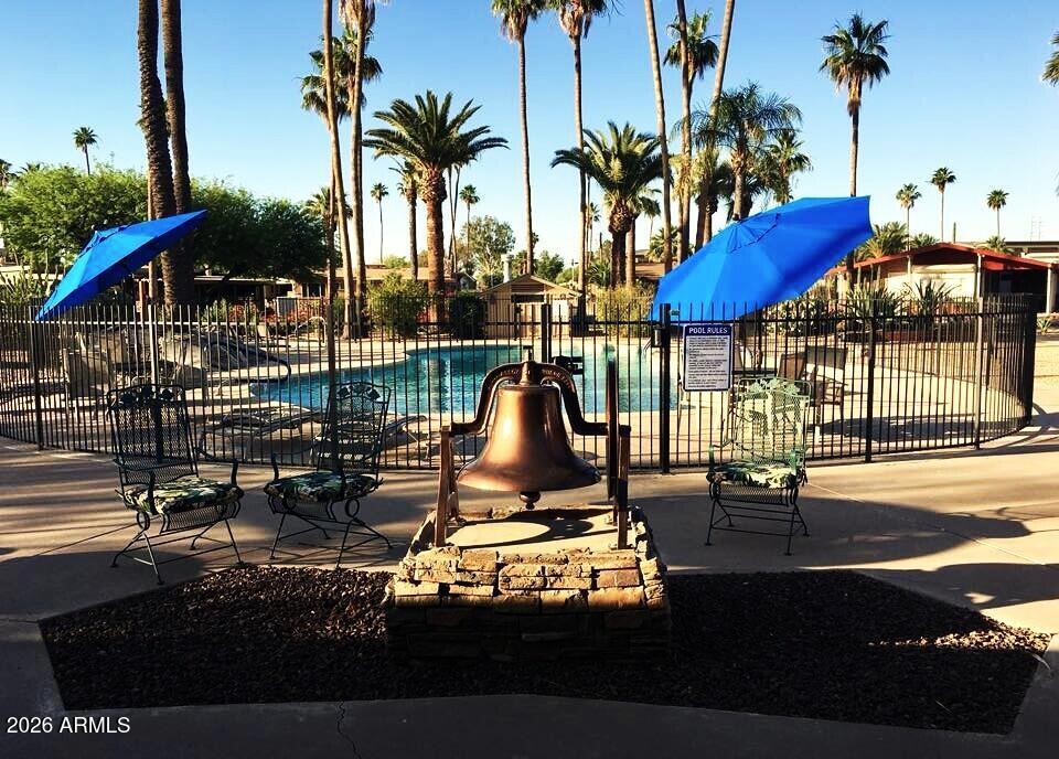 6700 East Thomas Road, Unit 25 Scottsdale, AZ 85251 - Photo 25 of 29 a view of a swimming pool with a lounge chair