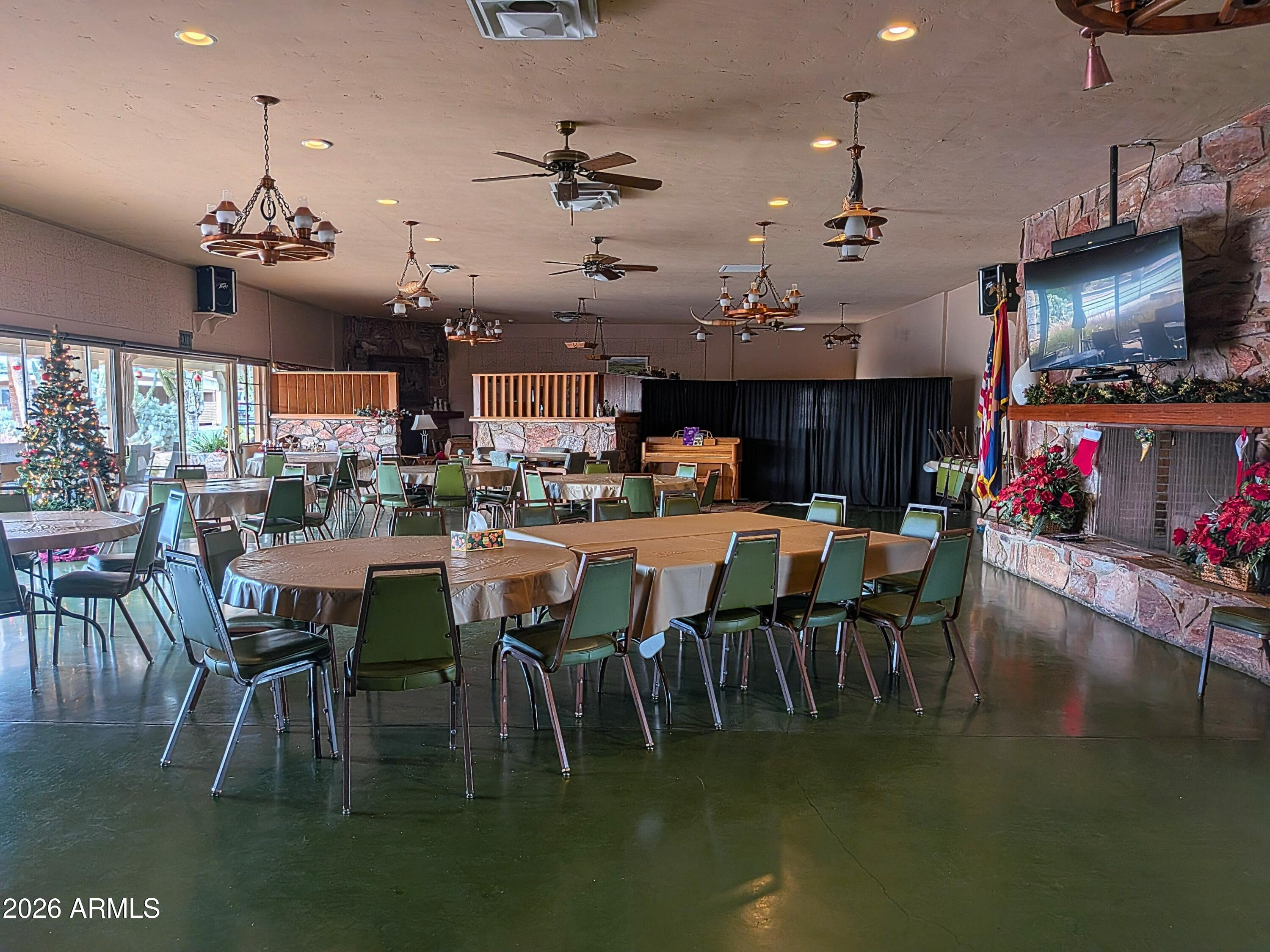 6700 East Thomas Road, Unit 25 Scottsdale, AZ 85251 - Photo 26 of 29 a view of a dining room with furniture a kitchen and chandelier
