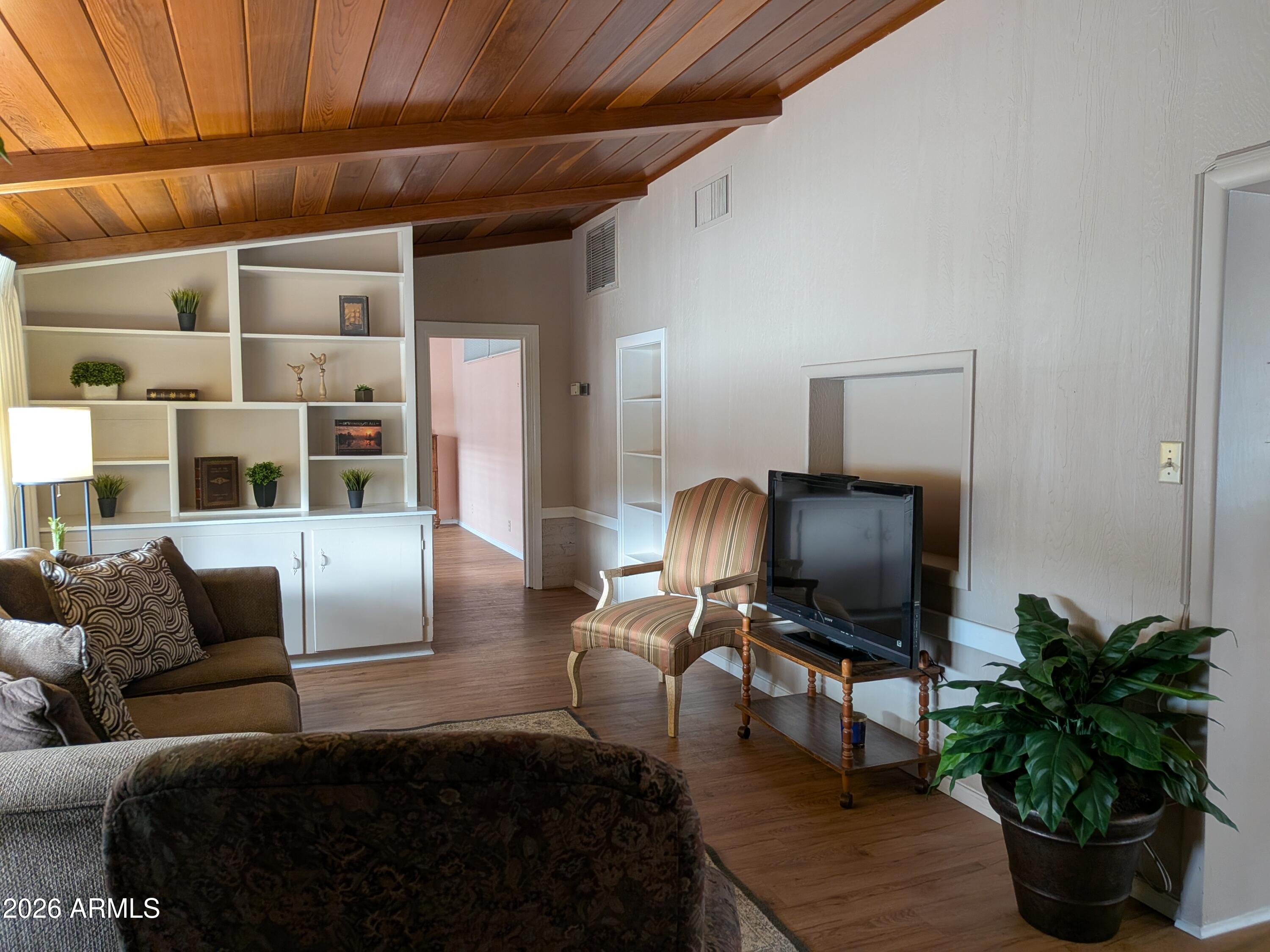 6700 East Thomas Road, Unit 25 Scottsdale, AZ 85251 - Photo 3 of 29 a living room with furniture and a flat screen tv