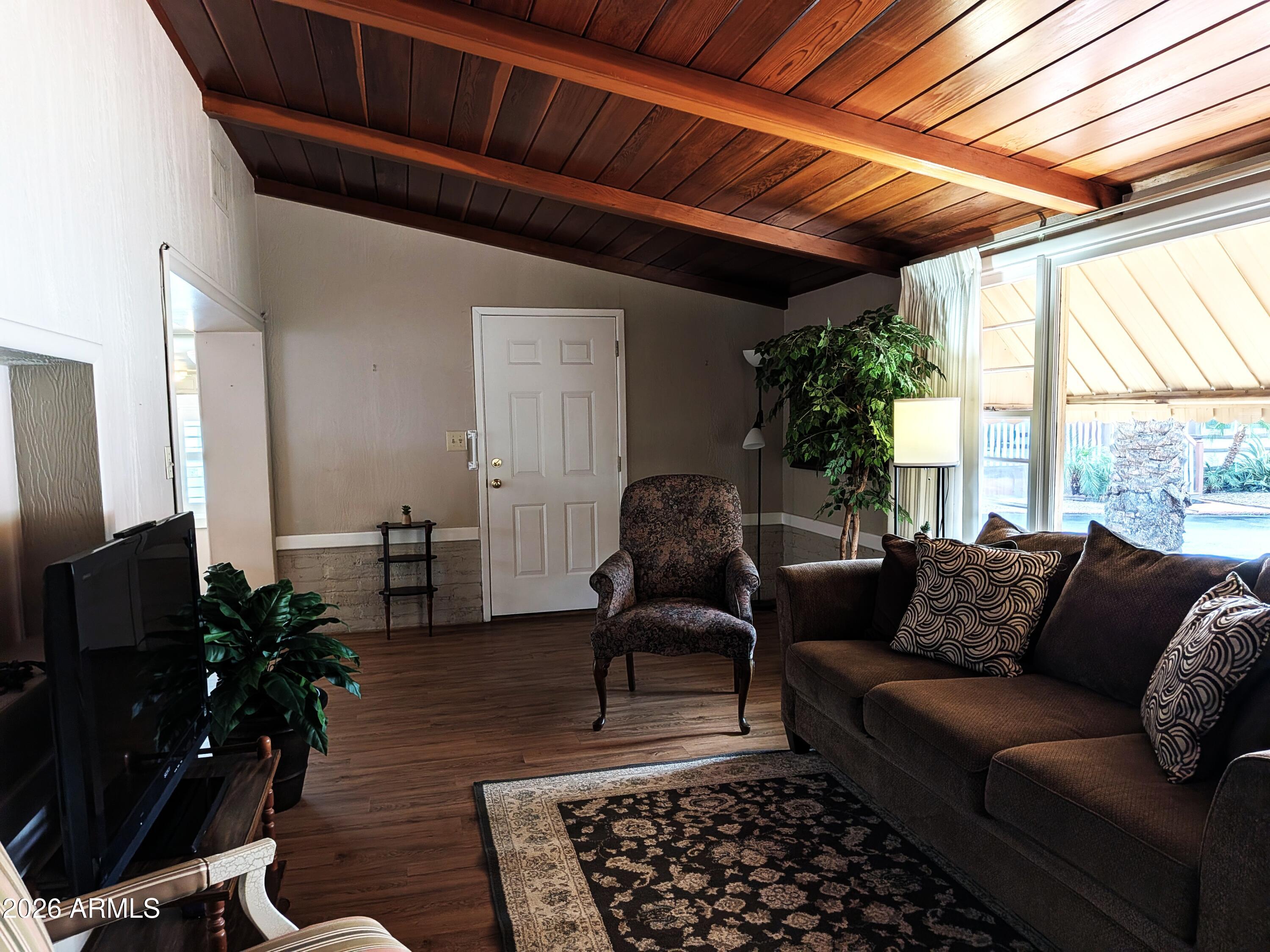 6700 East Thomas Road, Unit 25 Scottsdale, AZ 85251 - Photo 4 of 29 a living room with furniture and a window