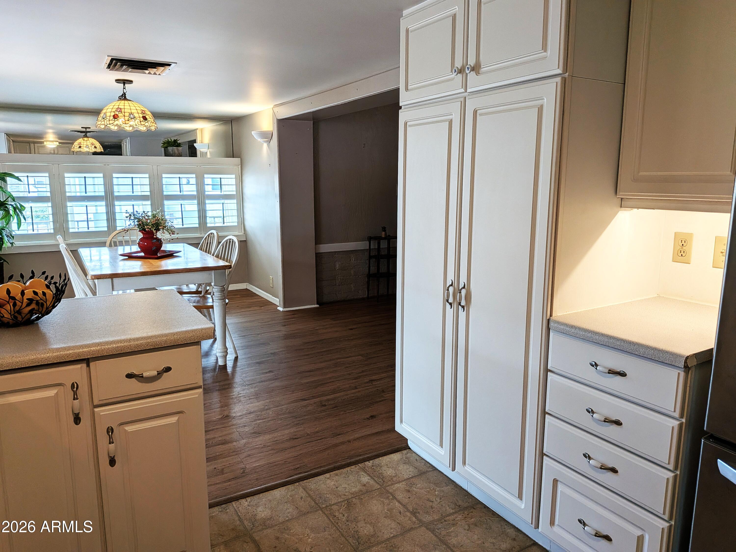 6700 East Thomas Road, Unit 25 Scottsdale, AZ 85251 - Photo 8 of 29 a kitchen with stainless steel appliances a refrigerator and cabinets