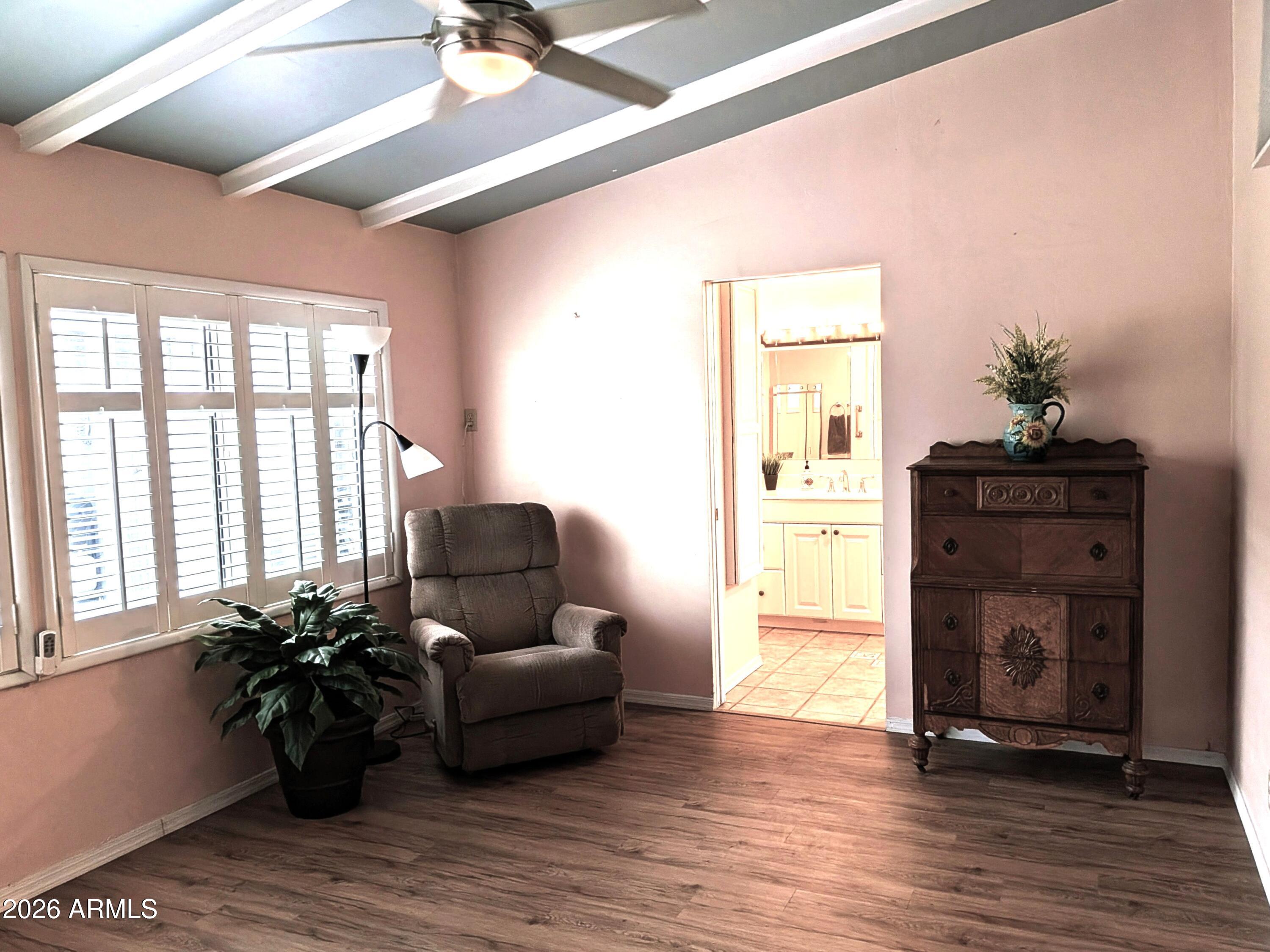 6700 East Thomas Road, Unit 25 Scottsdale, AZ 85251 - Photo 9 of 29 a living room with furniture and wooden floor