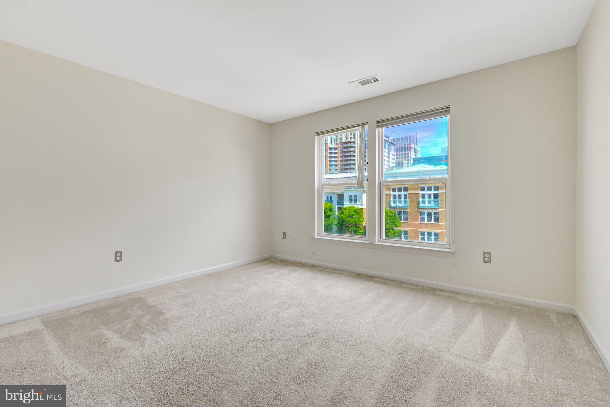 12001 Market Street, Unit 434 Reston, VA 20190 - Photo 21 of 43 a view of an empty room with a window