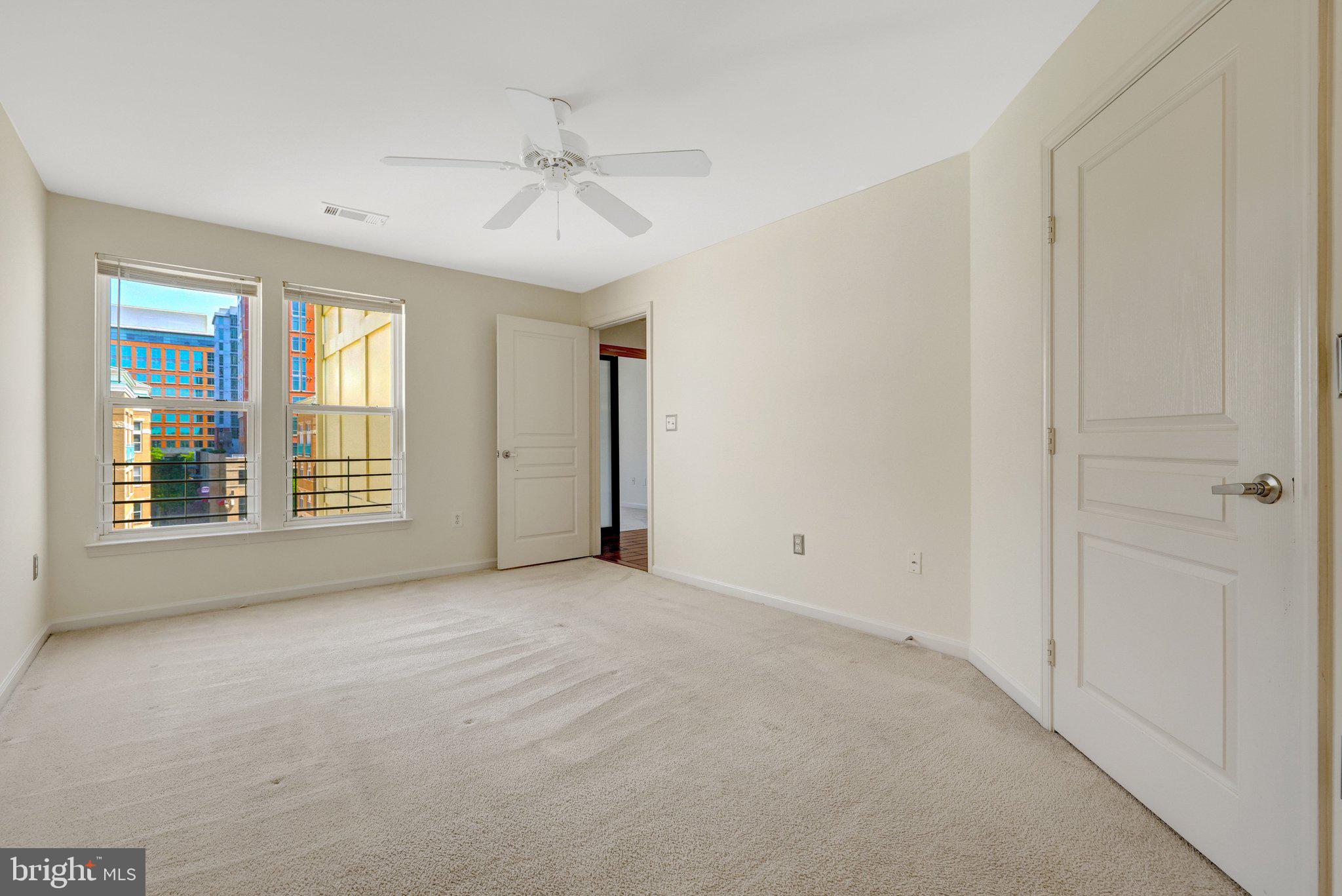 12001 Market Street, Unit 434 Reston, VA 20190 - Photo 24 of 43 a view of an empty room with a window