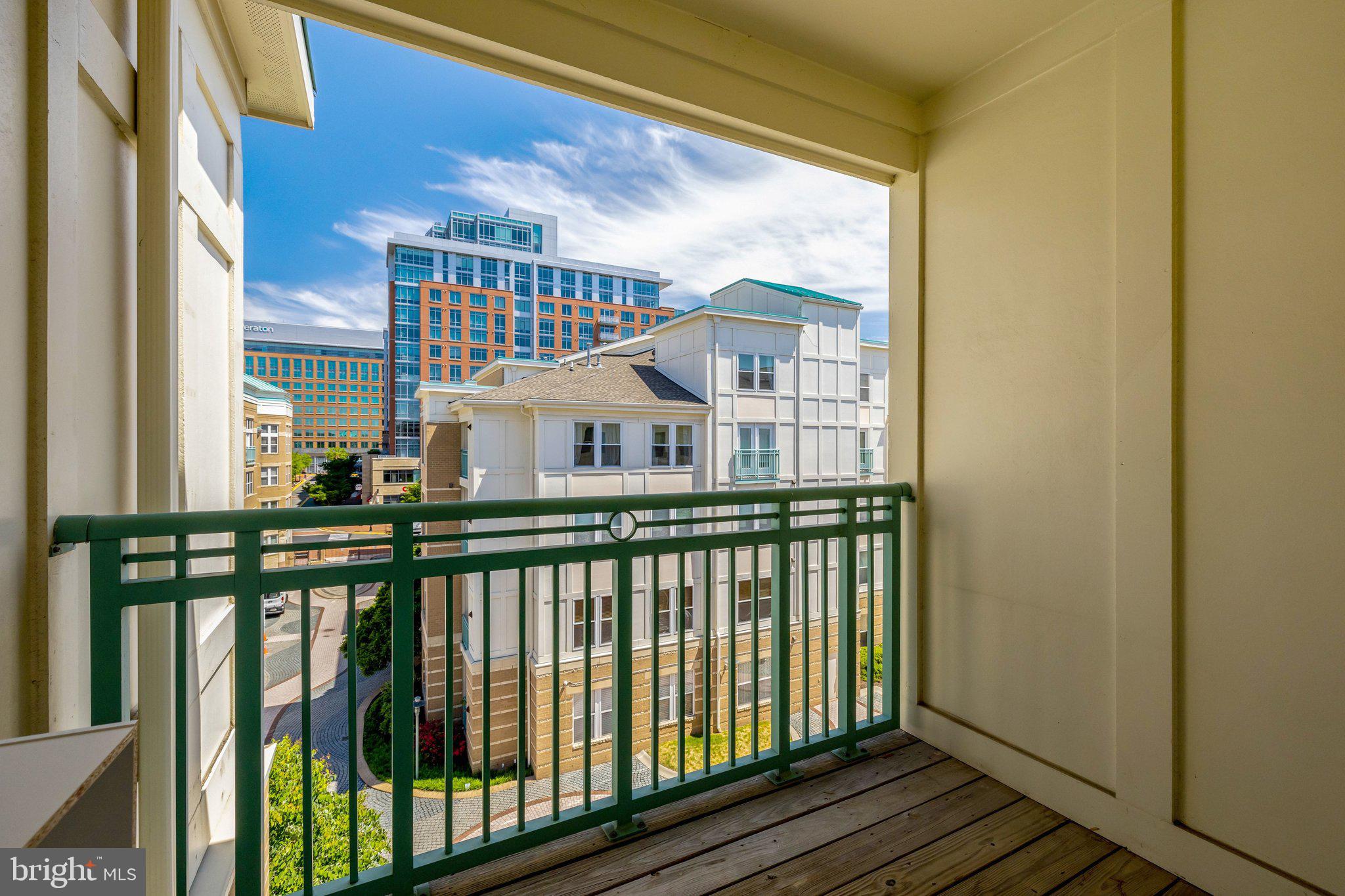12001 Market Street, Unit 434 Reston, VA 20190 - Photo 30 of 43 a view of a house with a balcony