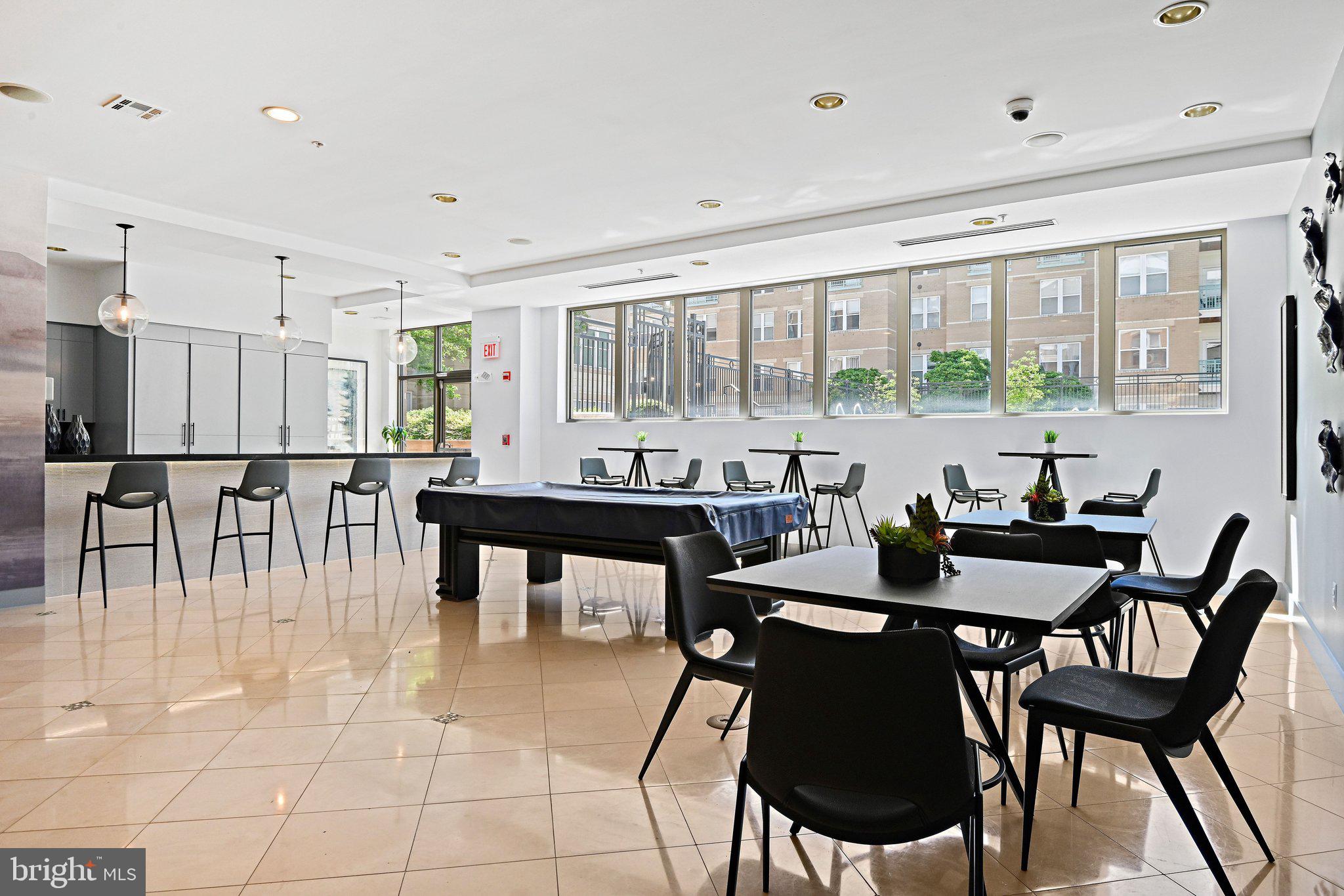 12001 Market Street, Unit 434 Reston, VA 20190 - Photo 38 of 43 a view of a dining room with furniture and window