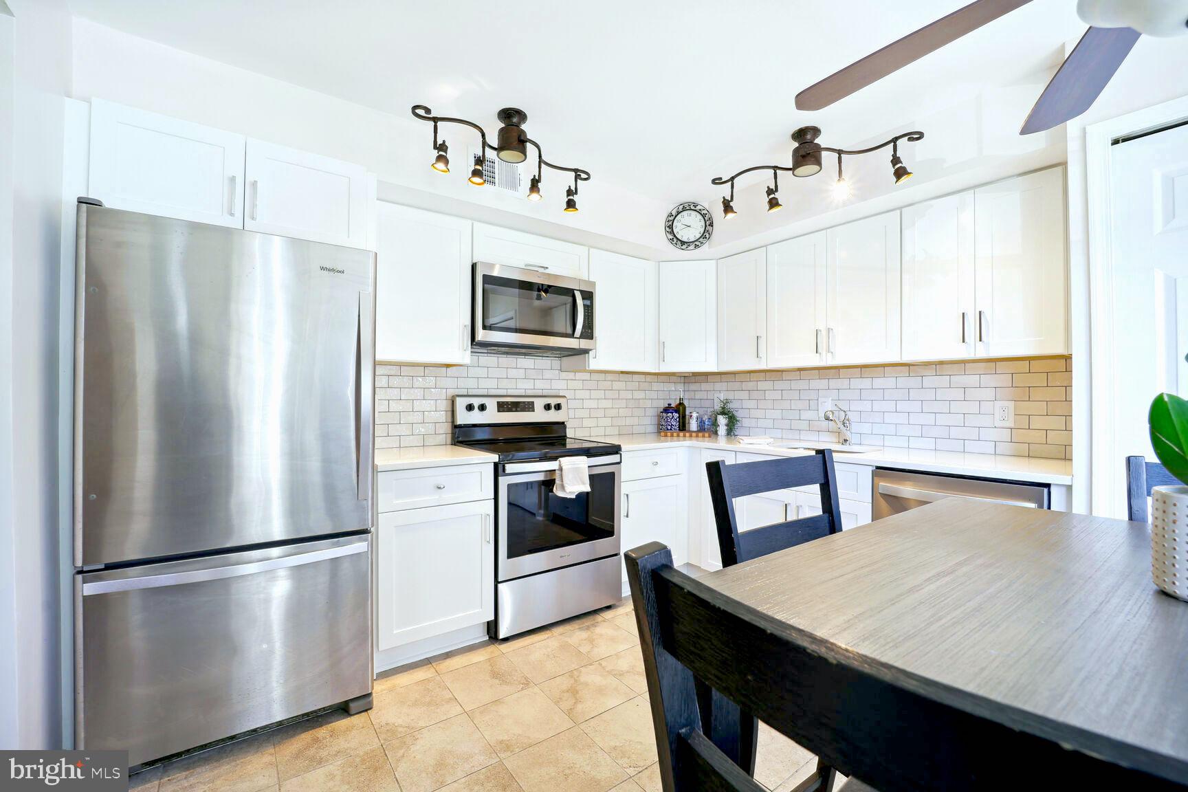 14506 MacBeth Drive, Unit 14506 Silver Spring, MD 20906 - Photo 3 of 28 Beautifully renovated eat-in kitchen w/bay window