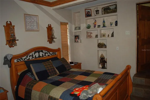 a bedroom with a bed and furniture