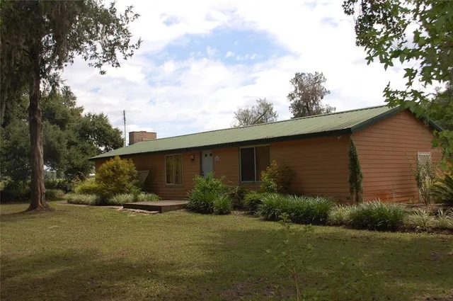 a backyard of a house with lots of green space