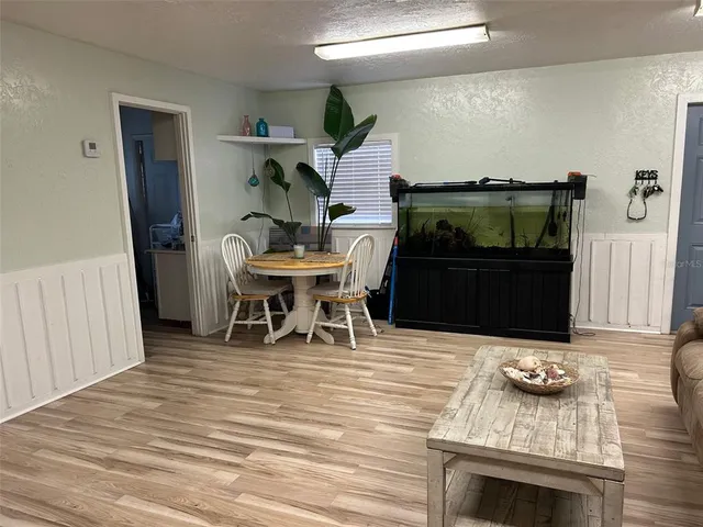 a kitchen with stainless steel appliances granite countertop a sink a stove and refrigerator