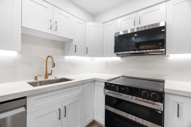 a view of a kitchen with a refrigerator