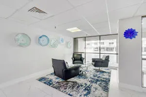 a view of a room with lots of furniture and wooden floor