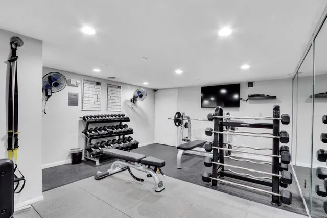 a room with pool table and windows