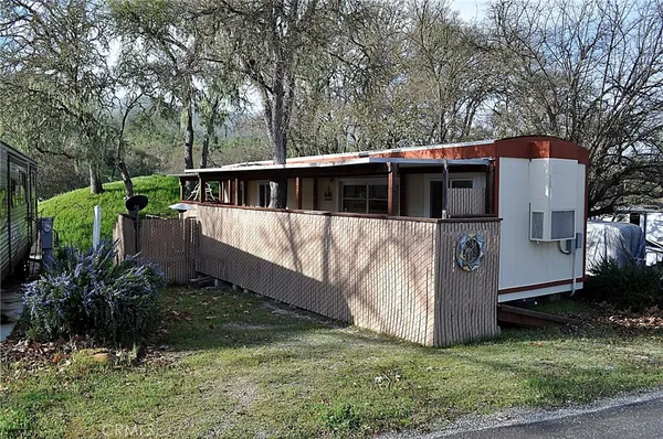 a view of a barn in the middle of a yard
