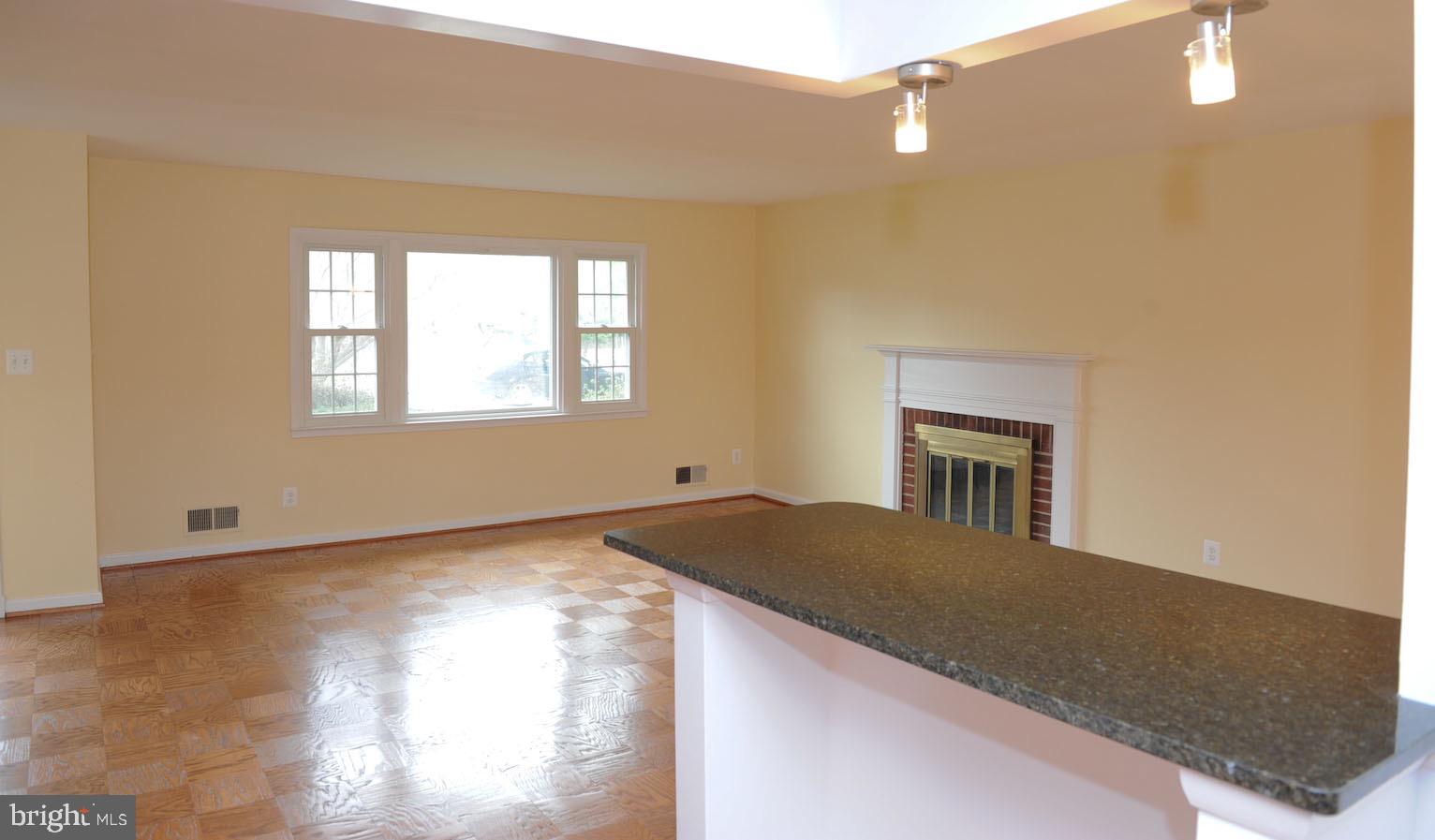 1342 Mayflower Drive McLean, VA 22101 - Photo 4 of 14 a view of a bedroom with wooden floor and windows
