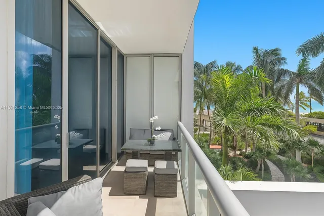 a balcony with view of outdoor space
