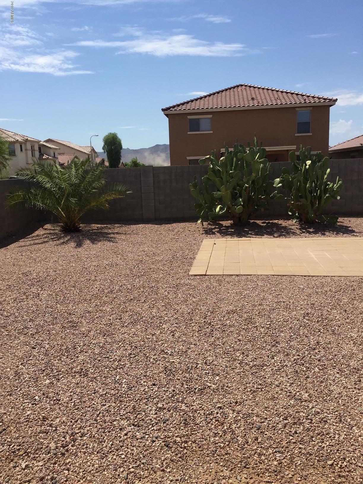 2515 West Romley Road Phoenix, AZ 85041 - Photo 15 of 20 a front view of a house with a yard