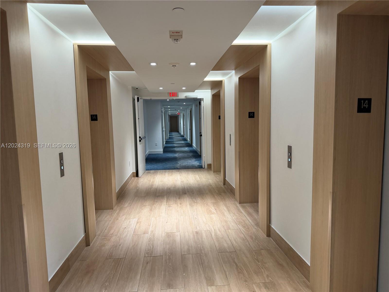90 Southwest 3rd Street, Unit 1409 Miami, FL 33130 - Photo 18 of 25 a view of gallery with wooden floor