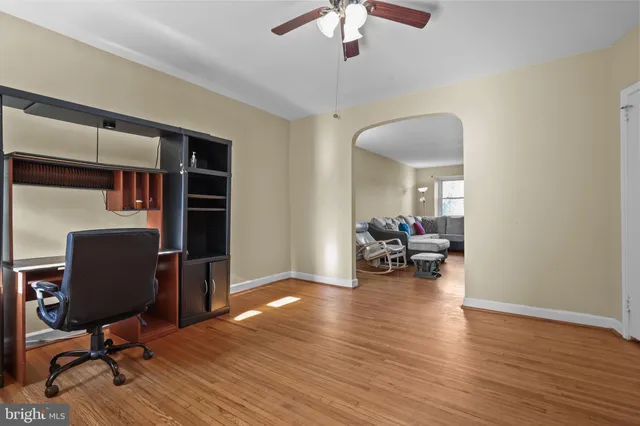 a view of a livingroom with workspace and a couch