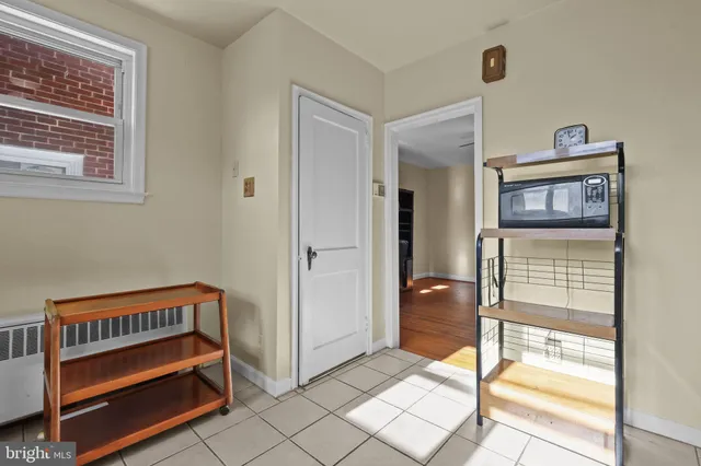 a bedroom with furniture and window