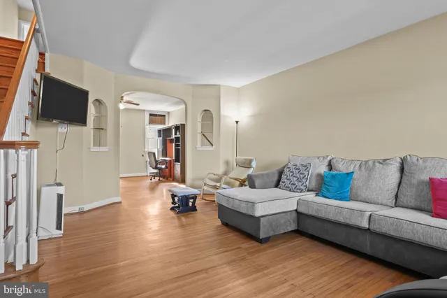 a living room with furniture and a flat screen tv