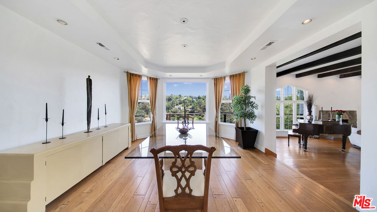 2312 Kimridge Road Beverly Hills, CA 90210 - Photo 9 of 60 a living room with furniture wooden floor and a large window
