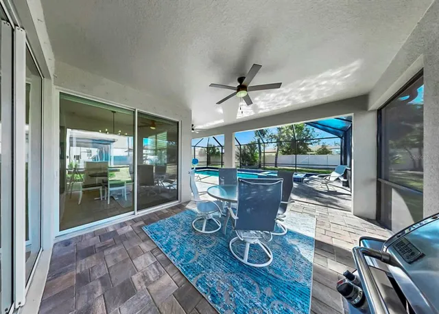 a view of a dining room with furniture wooden floor and chandelier