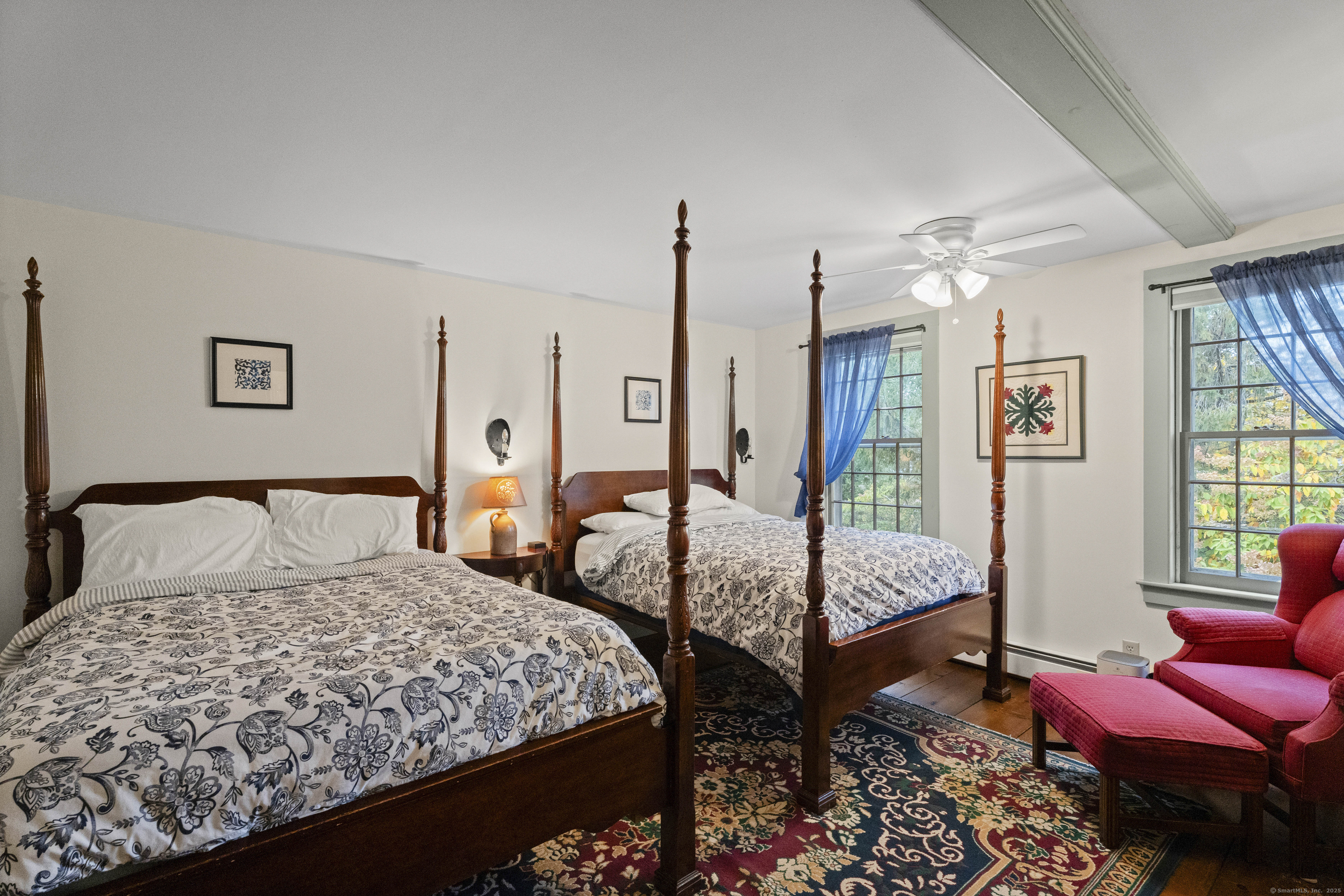 209 Main Street Deep River, CT 06417 - Photo 11 of 40 a bedroom with a bed and wooden floor