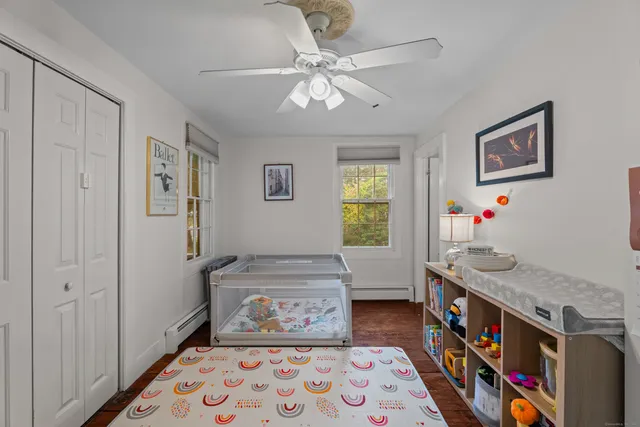 a very nice looking bedroom with a bed and a chandelier