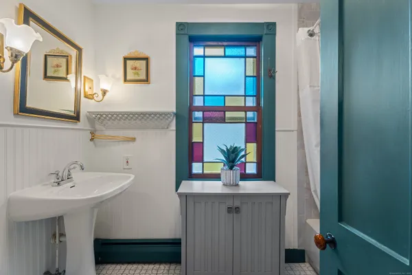 a bathroom with a sink and a mirror