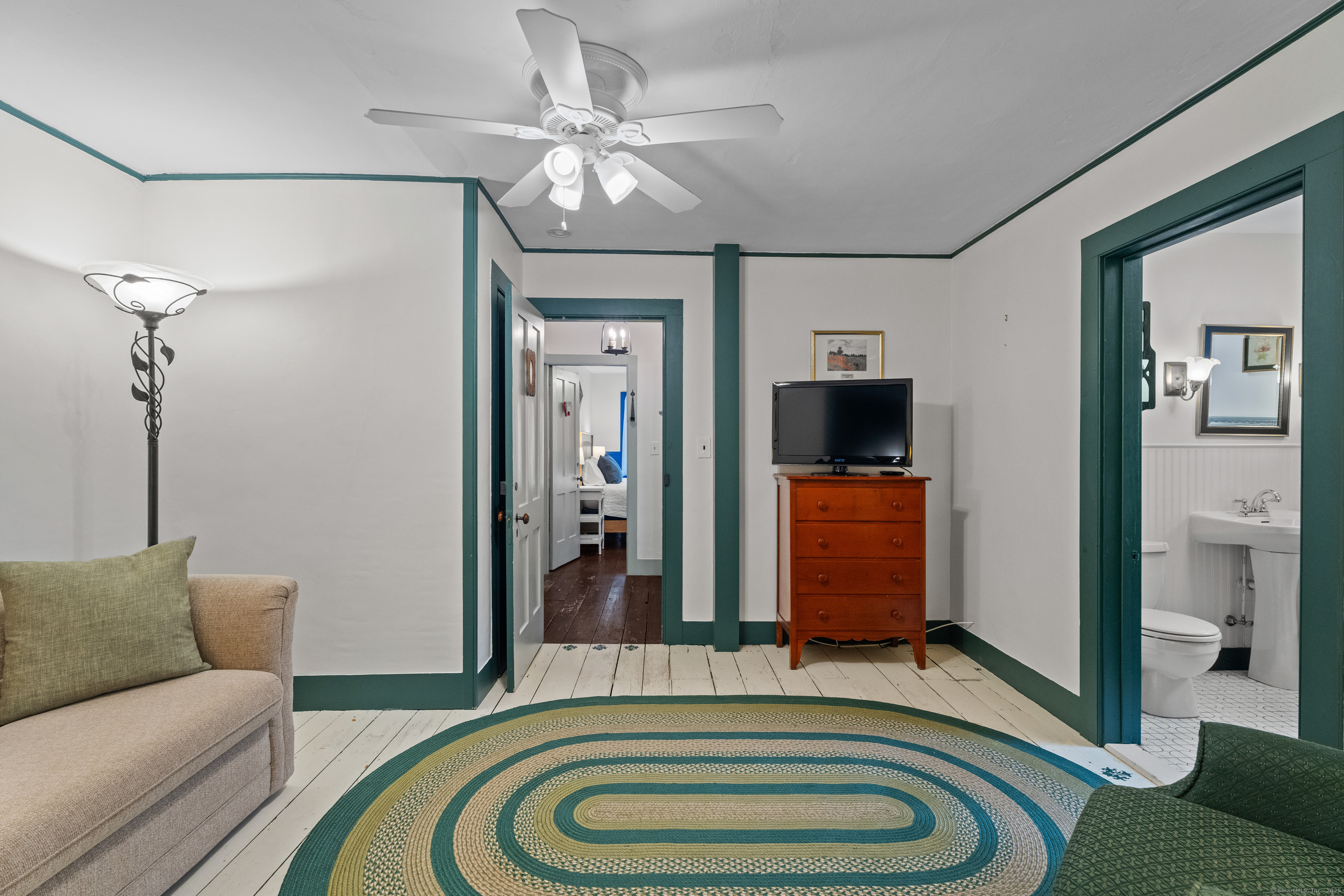 209 Main Street Deep River, CT 06417 - Photo 25 of 40 a living room with furniture and a flat screen tv