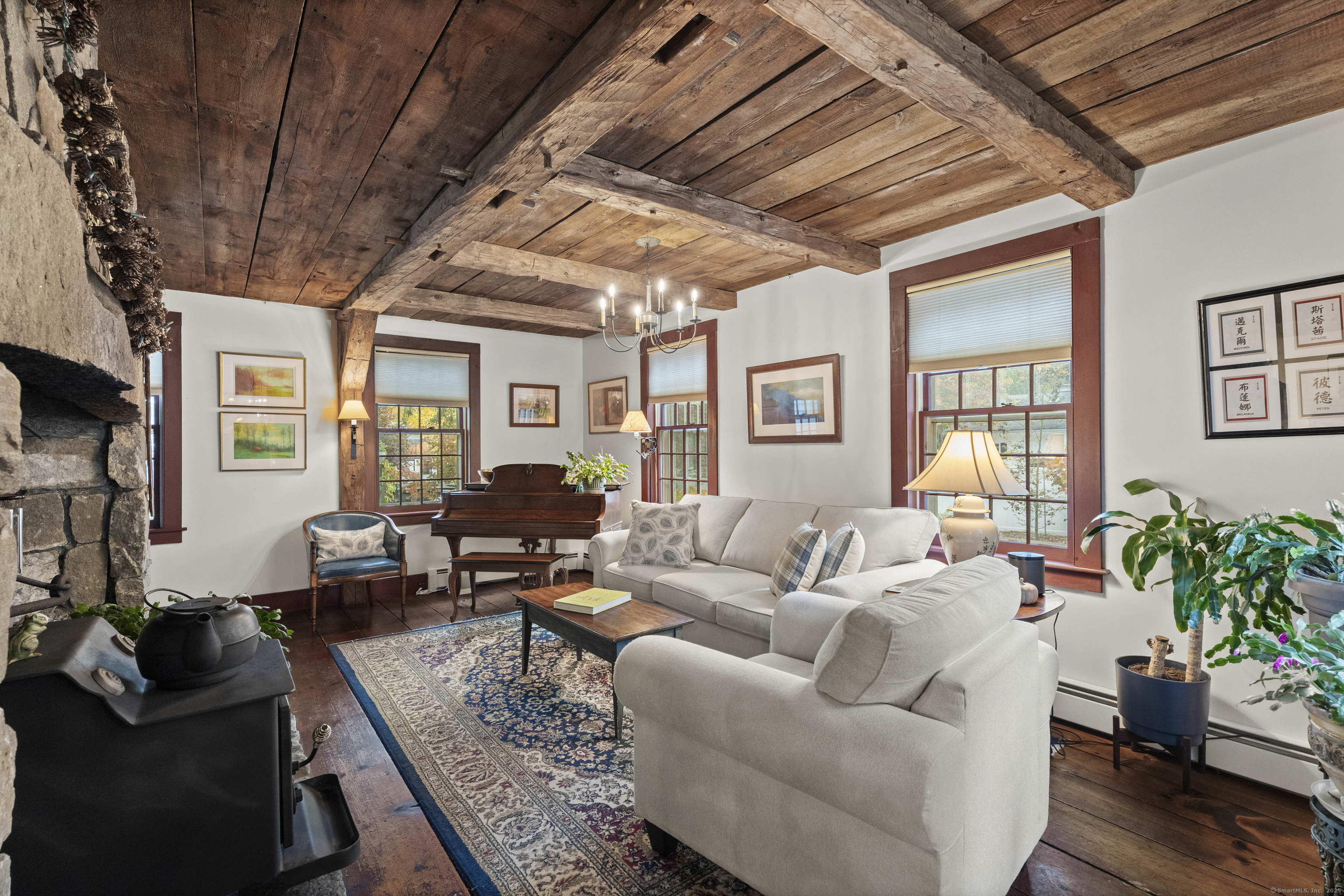 209 Main Street Deep River, CT 06417 - Photo 34 of 40 a living room with furniture potted plant wooden floor and a large window