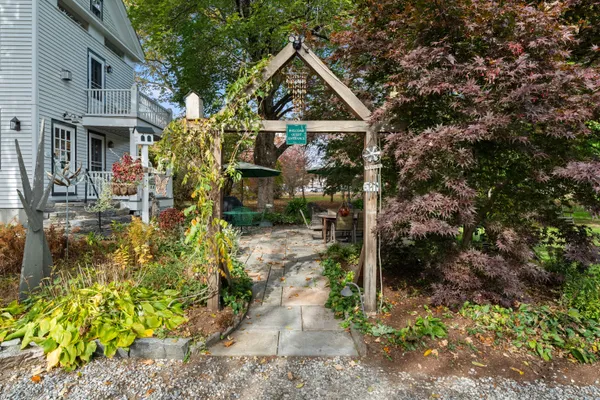 a front view of a house with garden