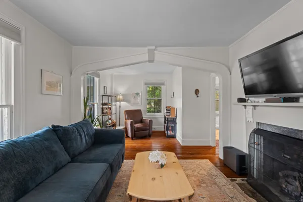 a living room with furniture and a flat screen tv