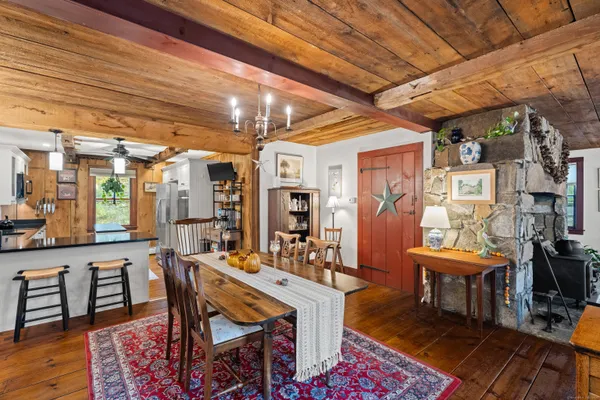 a room with lots of furniture and wooden floors