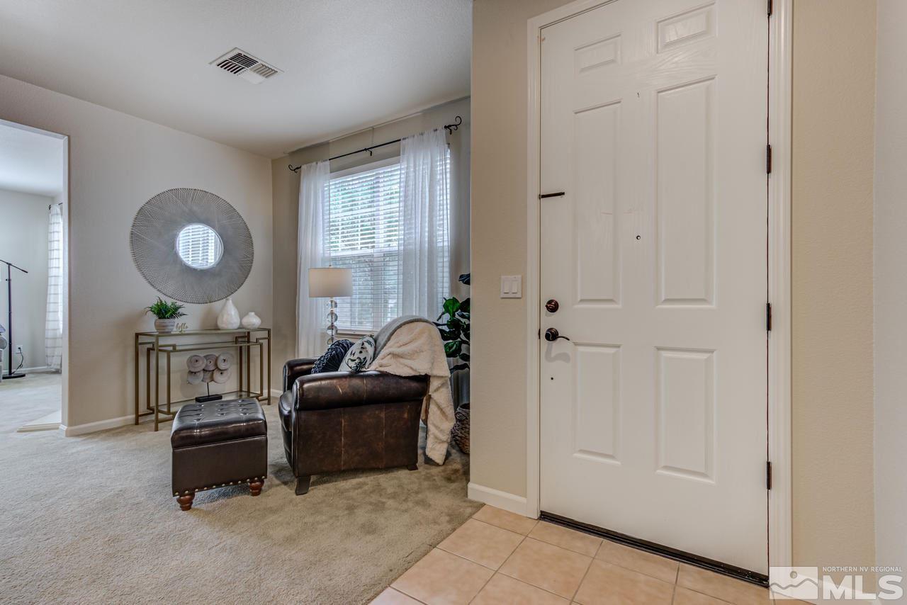 1808 Wind Ranch Road, Unit B Reno, NV 89521 - Photo 3 of 31 a living room with furniture and a window
