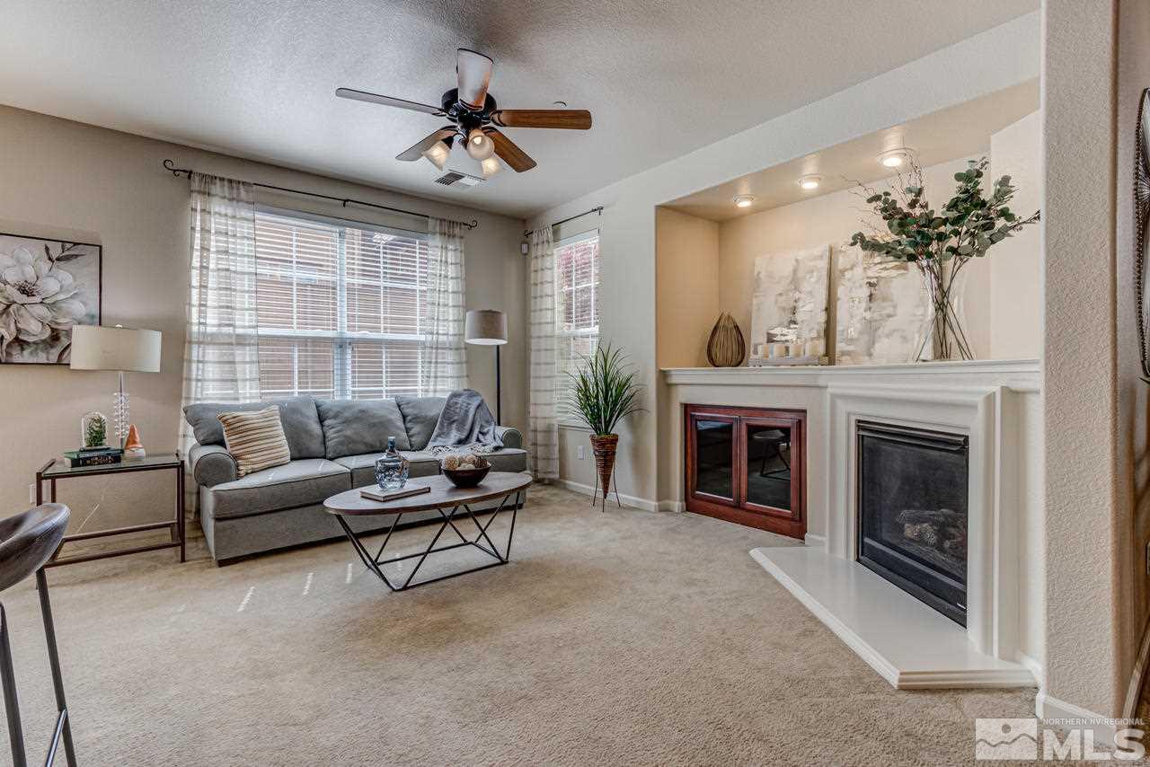 1808 Wind Ranch Road, Unit B Reno, NV 89521 - Photo 8 of 31 a living room with furniture and a fireplace