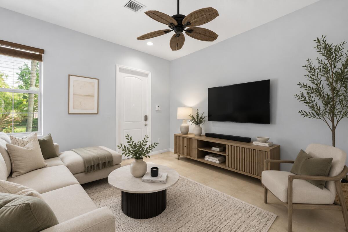 468 Francesca Ridge Road Boynton Beach, FL 33435 - Photo 2 of 11 a living room with furniture and a flat screen tv
