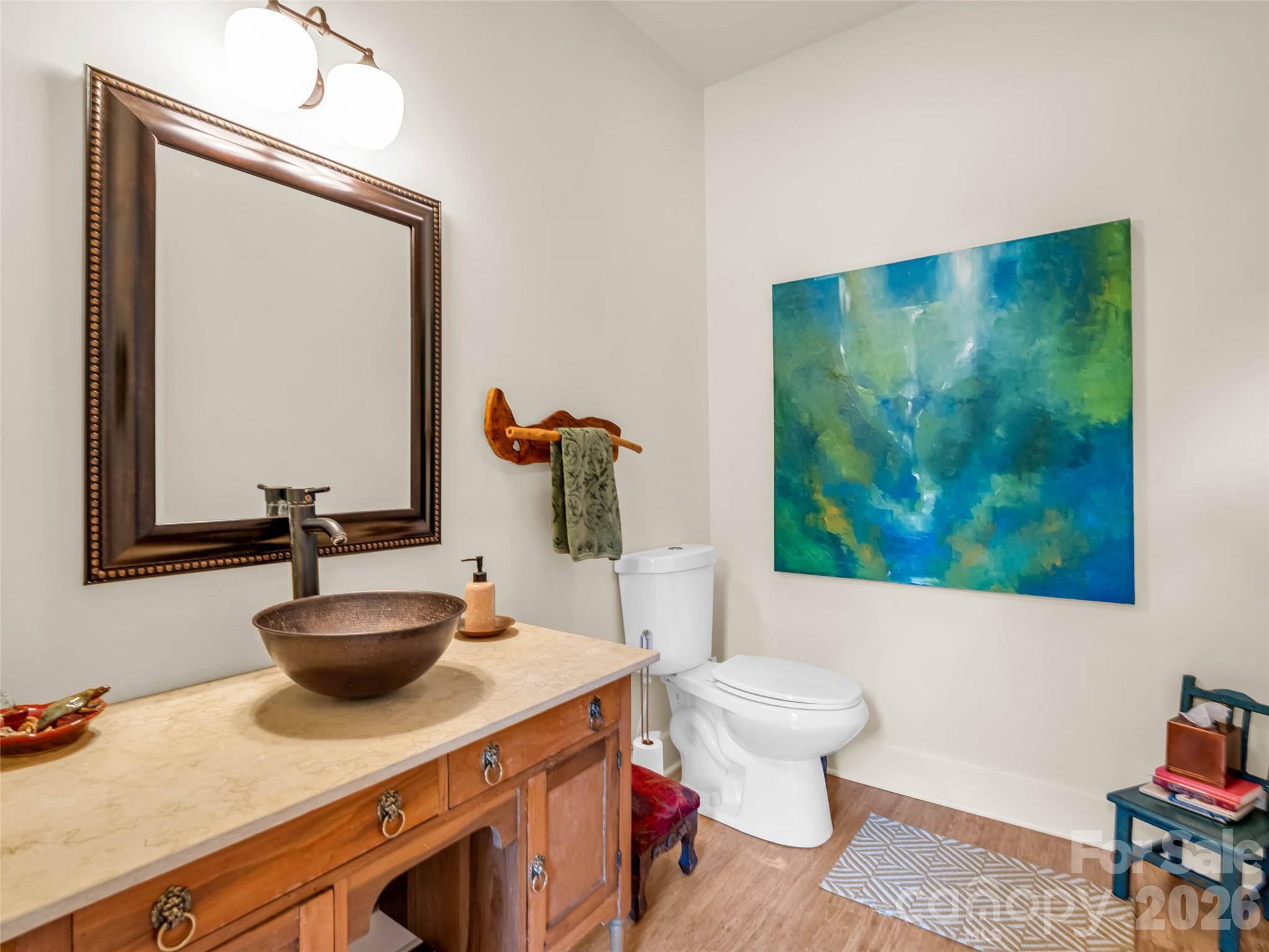 120 Glenn Court Mill Spring, NC 28756 - Photo 45 of 48 a bathroom with a sink a toilet and a mirror