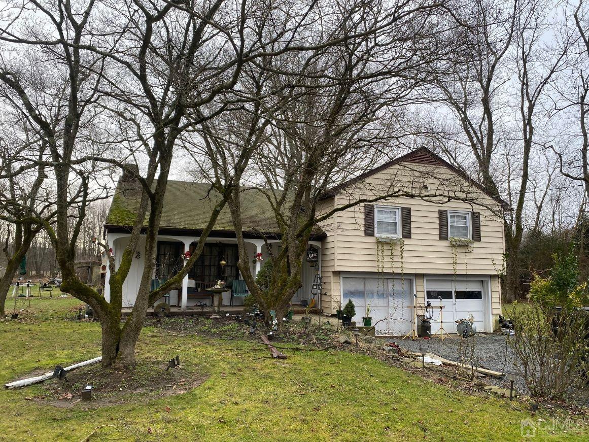 36 Halsey Reed Road Monroe Township, NJ 08831 - Photo 4 of 9 a front view of a house with garden