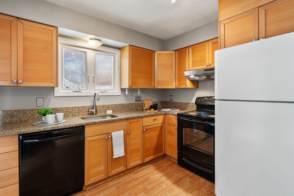 9 April Lane, Unit 9 Lexington, MA 02421 - Photo 18 of 38 a kitchen with a sink stove and refrigerator