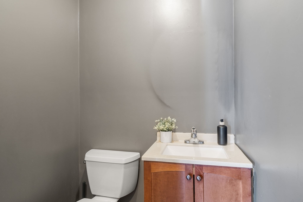9 April Lane, Unit 9 Lexington, MA 02421 - Photo 20 of 38 a bathroom with a toilet sink and mirror