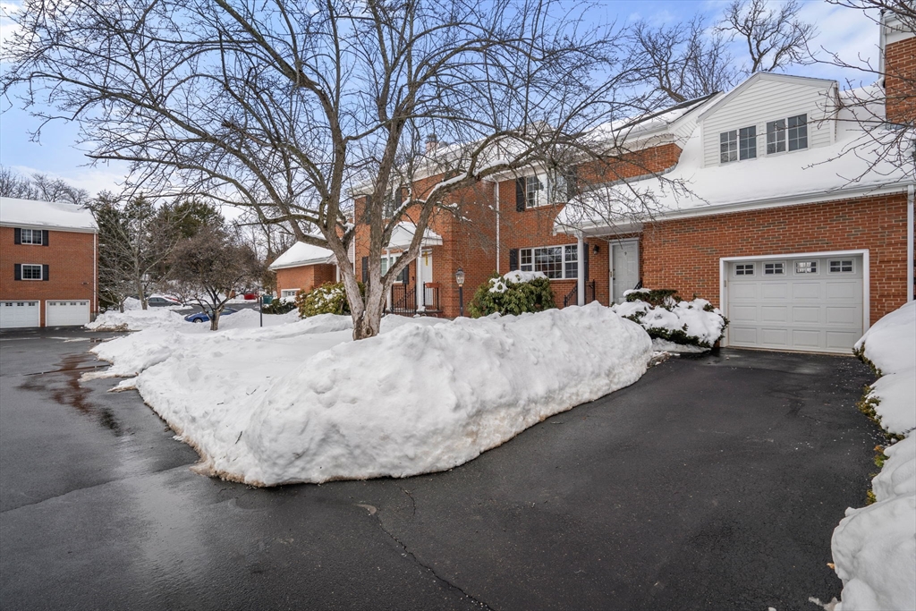 9 April Lane, Unit 9 Lexington, MA 02421 - Photo 2 of 38 a view of a white house with a street