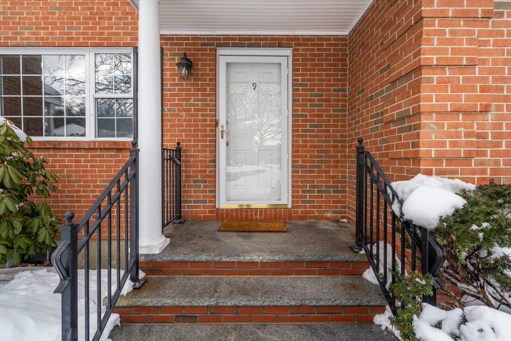 9 April Lane, Unit 9 Lexington, MA 02421 - Photo 3 of 38 a view of front door of house with stairs
