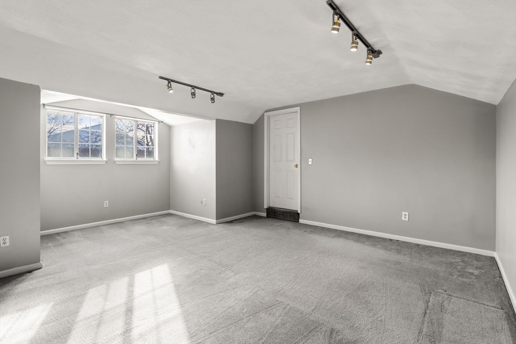 9 April Lane, Unit 9 Lexington, MA 02421 - Photo 31 of 38 a view of an empty room with a window